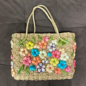 Vintage straw bag with colorful flowers